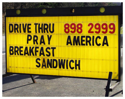 We pass these on the way home. What's a Pray America Breakfast Sandwich?
