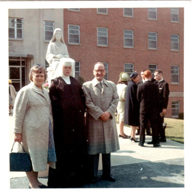 I remember this family - they lived in 60 - the nun's name is Elizabeth Lydon - 
Elizabeth and I attended St. Pauls together, as I recall for all 9 years and graduated 
in 1963 - Her parents are standing with her - I believe there were quite a few other girl children in the family all with blond, blond hair. (per Pat Miller)
