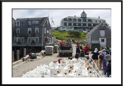 At the ferry slip, guests are greeted by local transportation and a few island inhabitants. (Monhegan Island, Maine, hotel)