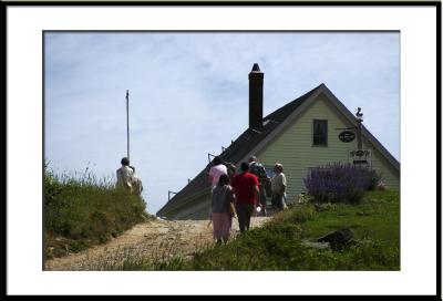 while those who have no transportation walk up the road to the village.(Monhegan Island, Maine)