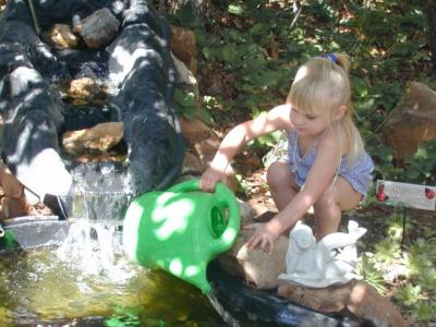 Kaelyn tends the pond