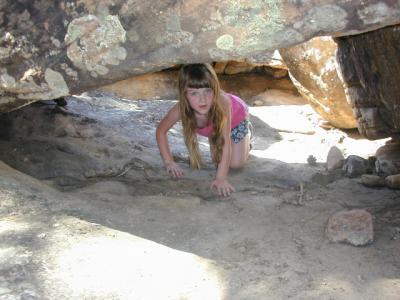<small>Taya explores<br>under the rock</small>
