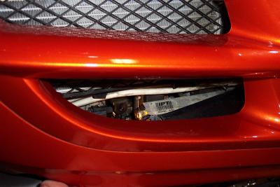 Here is a look at the port.  The chrome rail cover is pushed out of the way. I removed only the front allen screw on it.