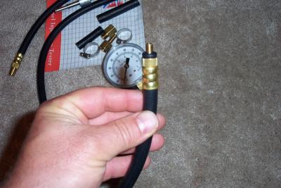 Now you need to quickly get this adapter threaded in. Be prepared to get gas all over yourself and anyone near you
