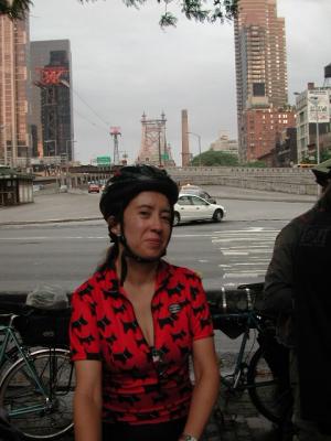 5BBC's Andrea Mercado waiting in Tramway Plaza for the Bridges by Night Ride to get underway. The 5 Borough Bicycle Club's web site is located at:  http://www.5bbc.org/