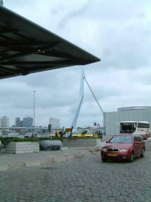 Roof of Cruise Terminal Rotterdam seems to be kept up by Erasmus bridge