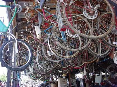 look at all the bikes hanging from the ceiling at all bikes