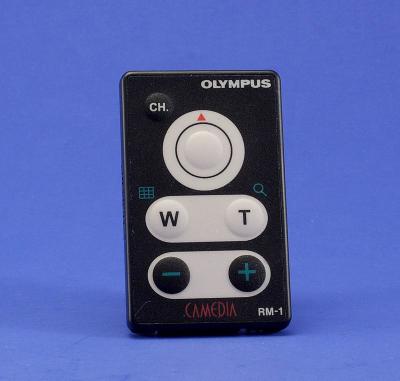 This is the RM-1 remote form Olympus. It can be use on a lot of Olympus cameras, on some cameras it will only do some features. On the C-2100 all the features will work, on the E-10 only the shutter button works. The range is about 10 feet indoors. It is very small, only 1 1/4 x 2 1/4 inches.

By Bill Huber