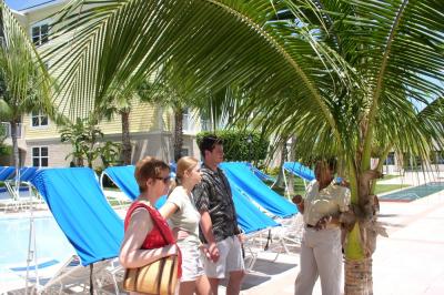 Condo saleslady at work by the pool at Harborside Condos