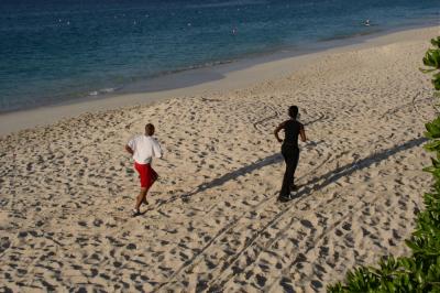 Joggers at the beach below the pool at PIBC
