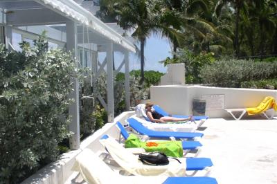 Sun tanning Cathy not yet cooling off beside the PIBC pool