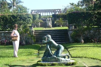 Cathy near a statue in the Cloisters Gardens