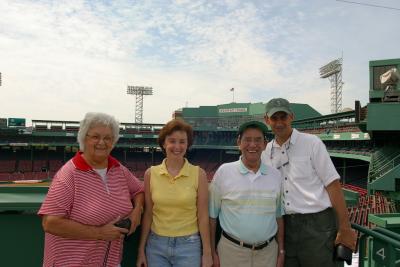 Mom, Charlotte, Dad and me on the left field wall in Fenway.