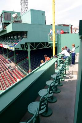 The new Monster Seats at Fenway Park. Fans actually sit on a stool with a small desk/bar on which to put refreshments, programs, etc.