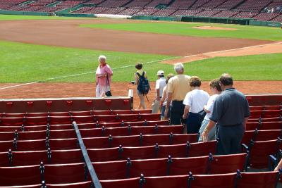 Mom, Charlotte and Dad setting foot on the Fenway field for the first time. That's six small steps for all mankind.