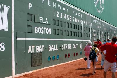 Up close and personal with the Green Monster. Tour Guide Jim explaining the morse code signage on the wall.