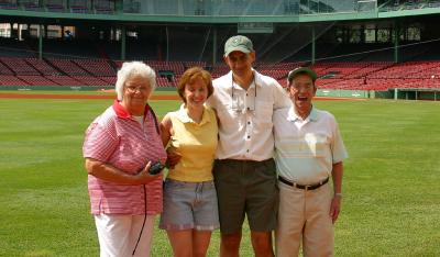 Mom, Charlotte, me and Dad in center field.