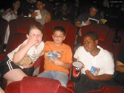 Ian made friends in the short wait before the movie i - Robot started.  the kids sat behind us with this boy and his mom