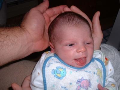 daddy and mommy's hands holding max.jpg