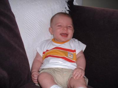 Aug8_laughing_max_on_couch.jpg