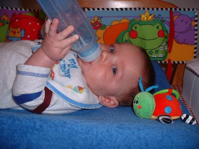 Max starts to get the hang of holding the bottle