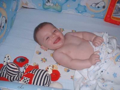 Max playing in the crib