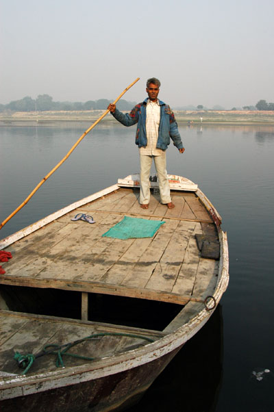 Riverside by the northeast tower, a boatman will ferry you across the river for excellent Taj views