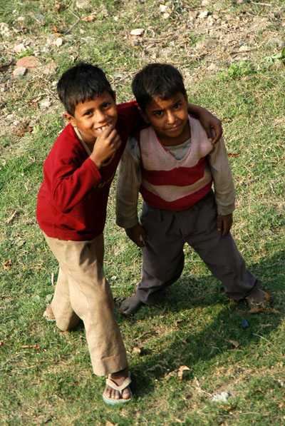 Kids begging from the base of the wall