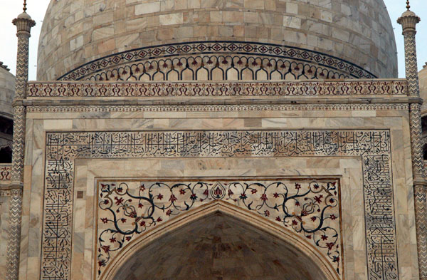 Intricate details cover the main mausoleum of the Taj
