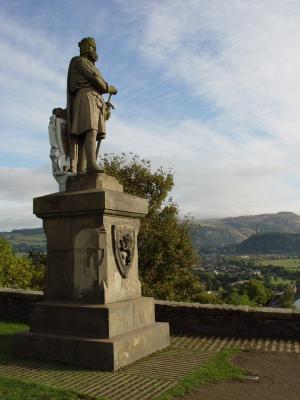 The Statue is located just outside the Stirling Castle on the Esplanade.  The Wallace Monument is located on the hill to the right side of the statue.

Sorry to all that I had mis-labeled the statue.