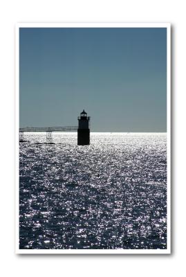 Ram Island Light on a bright fall day. (ocean, sparkling, lighthouse)