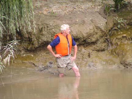 This poor man had to collect the ducks in a big net.