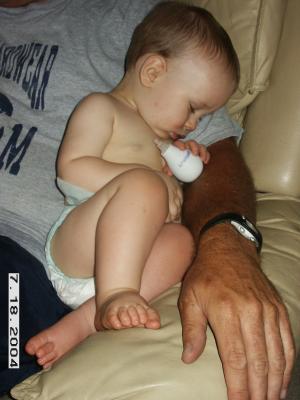 Comfy in Daddy's arm...