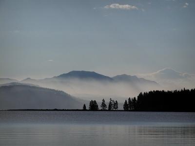 misty mountain morning across yellowstone lake