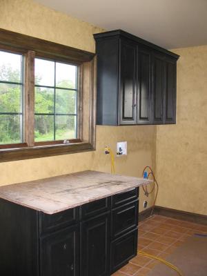 WOW - the laundry room cabinets are up,