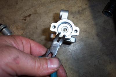 You have to remove the snap ring to remove the lower piston