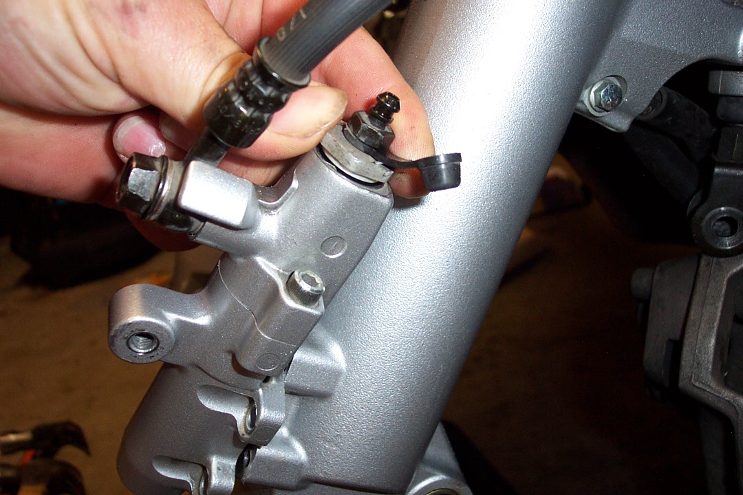 Here I am removing the top bleeder mount so I can then remove the upper piston