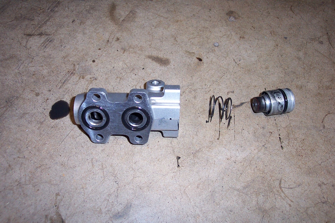 Here is the lower piston removed. There is a spring underneath it.