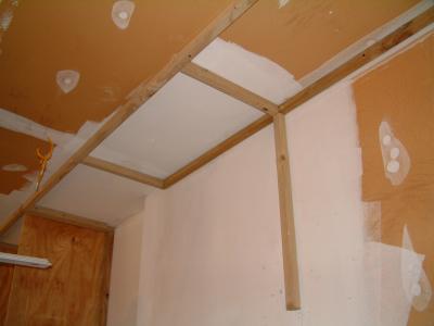Along all but 3 feet of the back wall