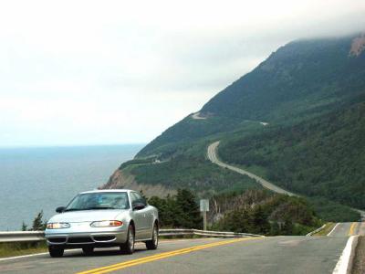 The Cabot Trail hugs the mountain side and winds its way around coastal views