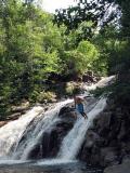Leaping off rocks at the popular Mary Ann Falls