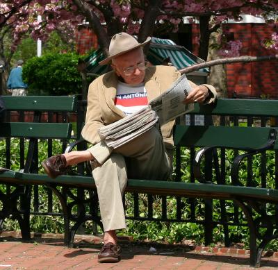 Texas Visitor Reading the Daily News in Washington Sq Park