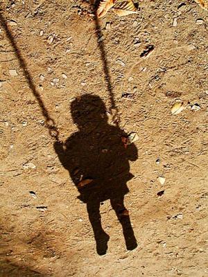 Shadow on a swing.