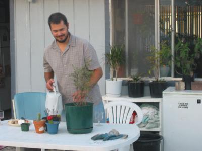 Tyler watering his plants