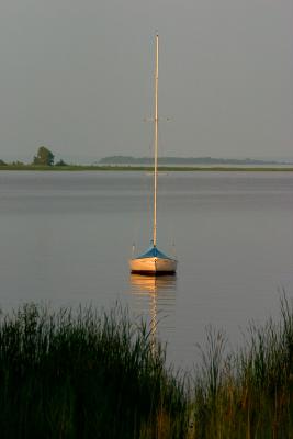 sailboat in green bay. at sunset