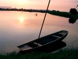 setting sun and boat