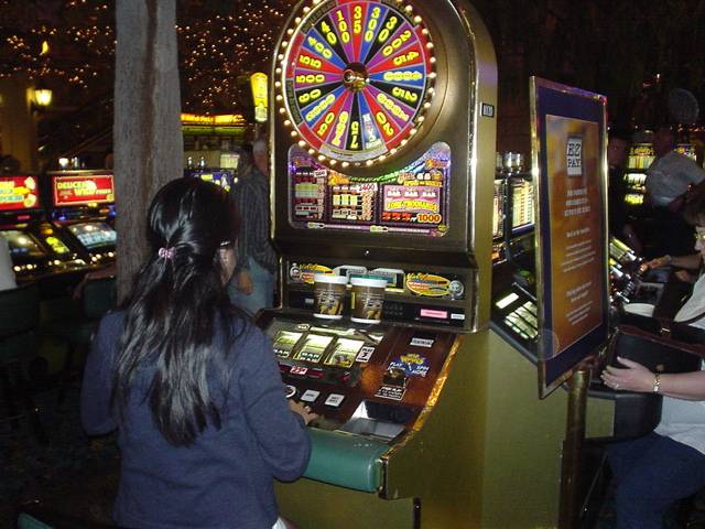 Trying her luck at the slots...