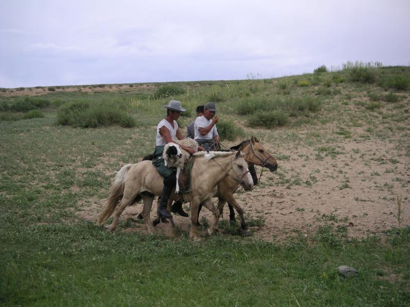 Herdsmen buy a sheep for dinner