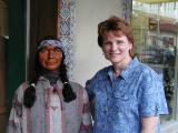 Patty poses with another wooden head!