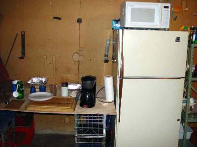 THIS WAS OUR KITCHEN FOR THREE MONTHS IN THE GARAGE NO SINK